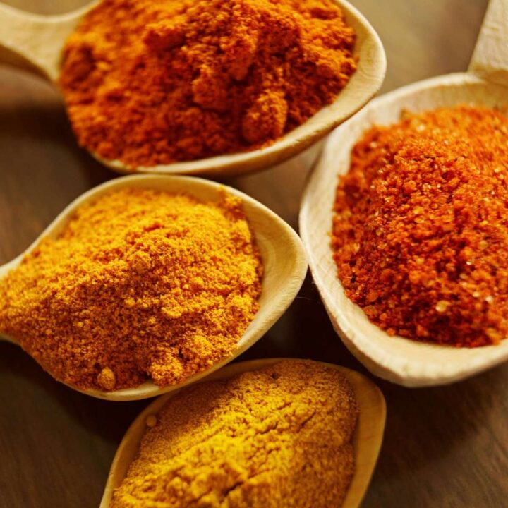 four Chorizo Seasonings in large wooden spoons