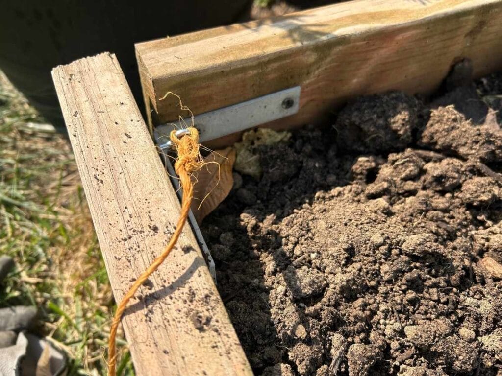 string attached to corner of garden bed