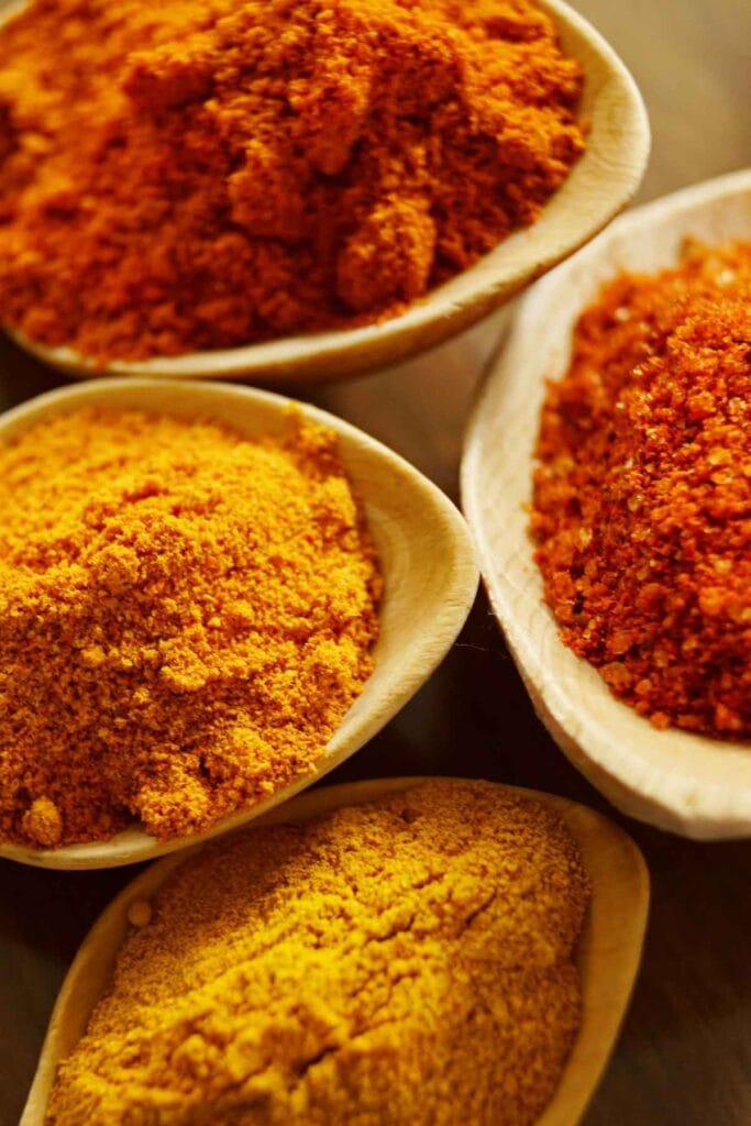 chorizo seasonings in large wooden spoons