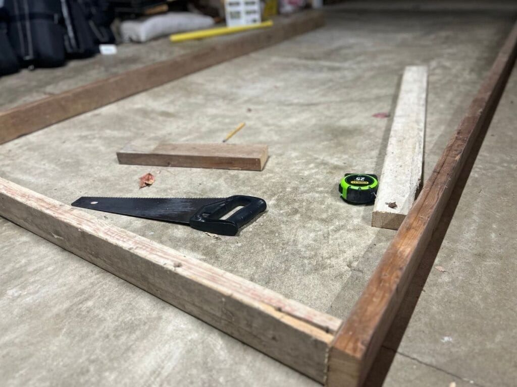 wood frame and tools for DIY mini greenhouse