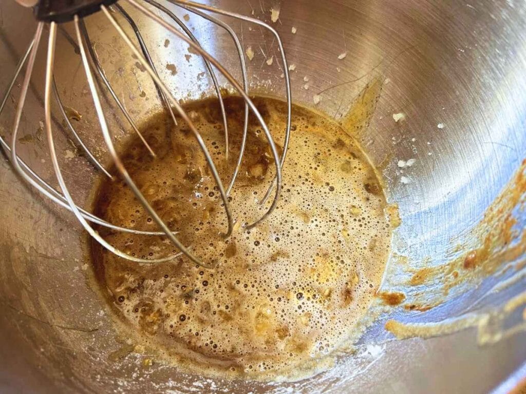 hot liquid sugar mixed with gelatin with a whisk