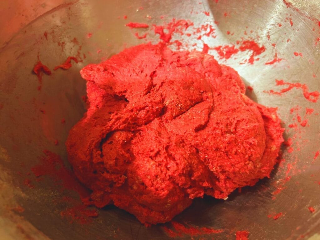 beet pizza dough in mixing bowl