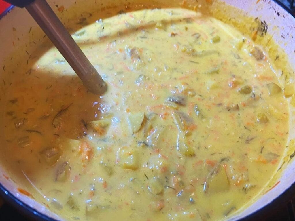 pulsing dill pickle soup with an immersion blender