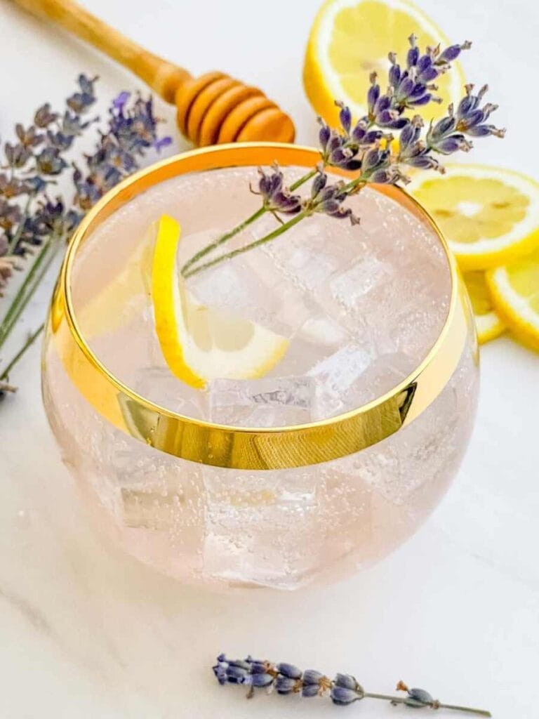 gold rimmed glass full of Lavender Field refreshing drink