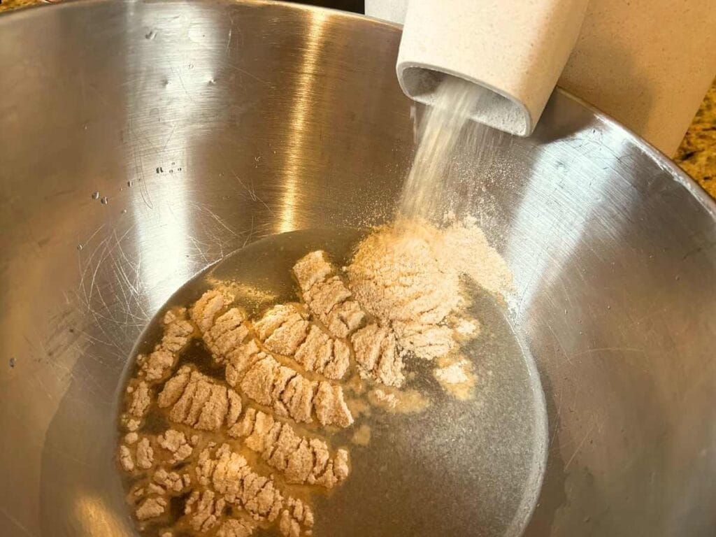 milling flour into bowl of water