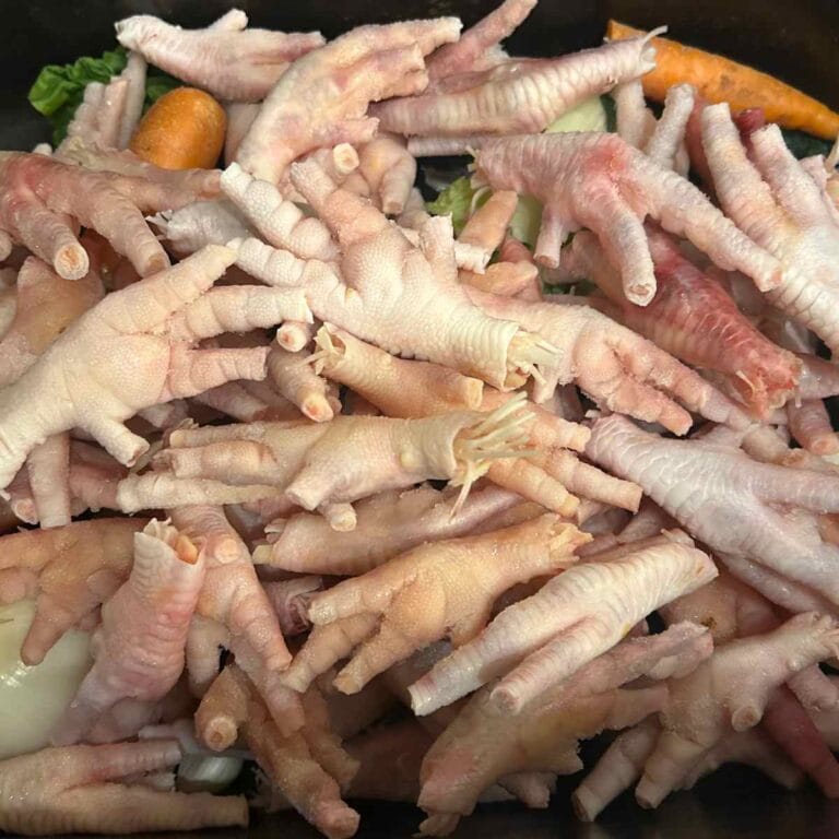 close up of chicken feet in a roaster pan