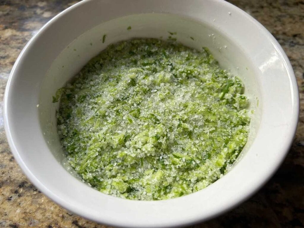 garlic scapes salt mixed in a ramekin before drying