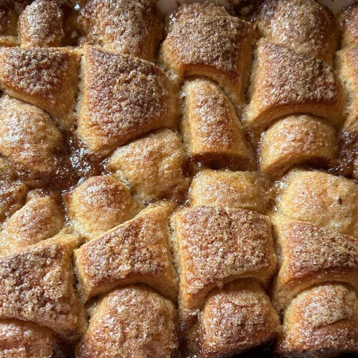 close up view of baked peach dumplings