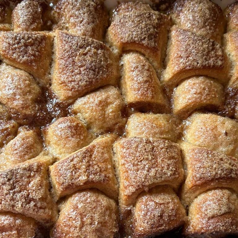 close up view of baked peach dumplings
