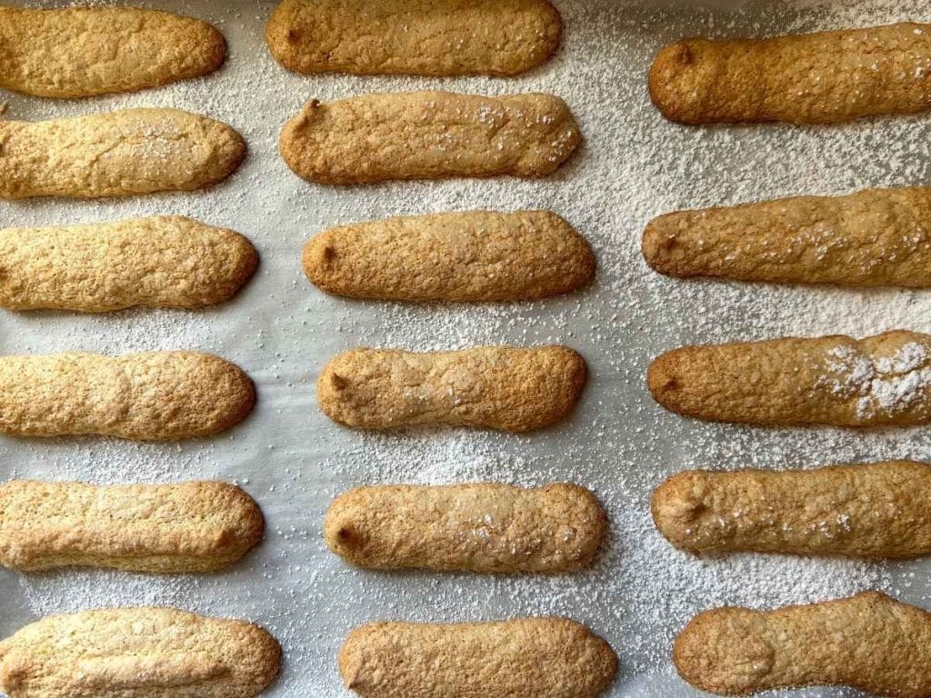 baked ladyfingers on a baking sheet